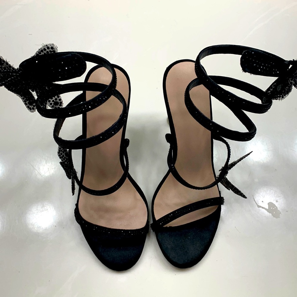 Size 5 wrap around butterfly high heels. Only worn twice. Paid $80 originally.